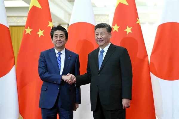 Japanese Prime Minister Abe Shinzo, left, and China’s leader, Xi Jinping, at the Great Hall of the People in Beijing, Dec. 23, 2019 (pool photo by Noel Celis via AP Images).
