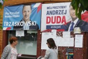 Campaign posters for two contenders in Poland’s presidential election runoff, the conservative incumbent, Andrzej Duda, and his liberal rival, Warsaw mayor Rafal Trzaskowski, in Raciaz, Poland, July 9, 2020 (AP Photo by Czarek Sokolowski).