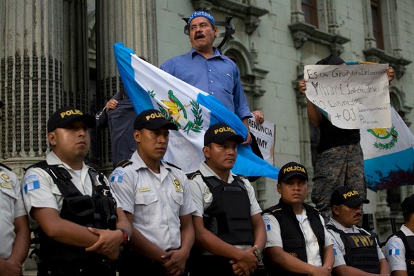 People protest against a decision by then-President Jimmy Morales to shut down the International Commission against Impunity in Guatemala, or CICIG, in Guatemala City, Sept. 1, 2018 (AP photo by Moises Castillo).