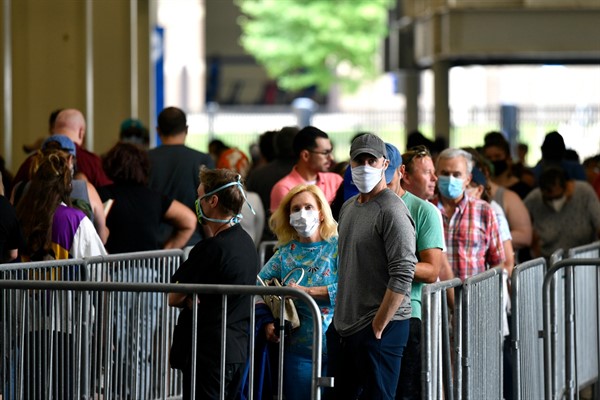 Voters wait in line to cast their ballots in the Kentucky primary election, Lexington, Ky., June 23, 2020 (AP photo by Timothy D. Easley).