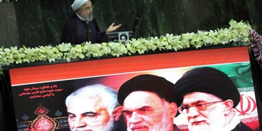 Iranian President Hassan Rouhani speaks behind a screen showing portraits of the late Gen. Qassem Soleimani, the late revolutionary founder Ayatollah Khomeini, and Supreme Leader Ayatollah Ali Khamenei, Tehran, Iran, May, 27, 2020 (AP Photo/Vahid Salemi).