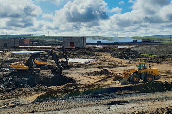Workers prepare an area for reservoirs for contaminated soil after a fuel spill outside Norilsk, northern Russia, June 18, 2020 (Russian Emergency Situations Ministry photo via AP Images).