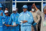 Somalia’s president, Mohamed Abdullahi Mohamed, center, prepares to cut the ribbon for the reopening of a stadium in Mogadishu, Somalia, June 30, 2020 (AP photo by Farah Abdi Warsameh).