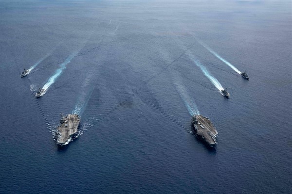 The USS Ronald Reagan and USS Nimitz Carrier Strike Groups steam in formation in the South China Sea, July 6, 2020 (Photo by Mass Communication Specialist 3rd Class Jason Tarleton for U.S. Navy via AP Images).