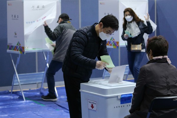 A man casts his vote for the parliamentary election at a polling station in Seoul, South Korea, April 15, 2020 (AP photo by Ahn Young-joon).