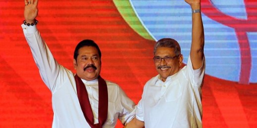 Sri Lankan President Gotabaya Rajapaksa, right, and his brother, Prime Minister Mahinda Rajapaksa, wave during a party convention in Colombo, Sri Lanka, Aug. 11, 2019 (AP photo by Eranga Jayawardena).