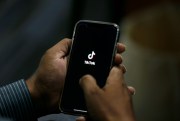 A man opens the social media app TikTok on his cell phone, in Islamabad, Pakistan, July 21, 2020 (AP photo by Anjum Naveed).
