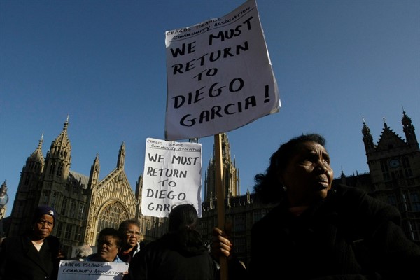 People protest outside Parliament after a court ruling deciding Chagossians were not allowed to return to their homeland, London, Oct. 22, 2008 (AP photo by Matt Dunham).