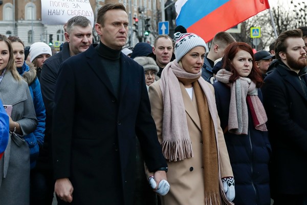 Russian opposition leader Alexei Navalny, center left, and his wife Yulia, during a march in Moscow, Russia, March 29, 2020 (AP photo by Pavel Golovkin).
