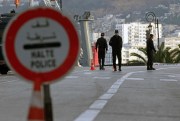 Security forces at a checkpoint to enforce a curfew aimed at preventing the spread of coronavirus in Algiers, Algeria, April 8, 2020 (AP photo by Toufik Doudou).