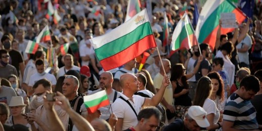 Protesters carry Bulgarian flags during a demonstration in Sofia, Bulgaria, July 29, 2020 (AP photo by Valentina Petrova).