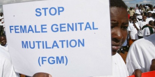 A Masai girl holds a sign during a protest against female genital mutilation, in Kilgoris, Kenya, April 21, 2007 (AP file photo by Sayyid Azim).