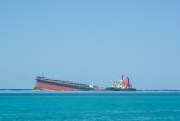 The MV Wakashio, a Japanese ship that ran aground off the southeast coast of Mauritius, seen from the coast of Mahebourg, Mauritius, Aug. 12, 2020 (Photo by Kooghen Modeliar-Vyapooree for L’express Maurice via AP Images).