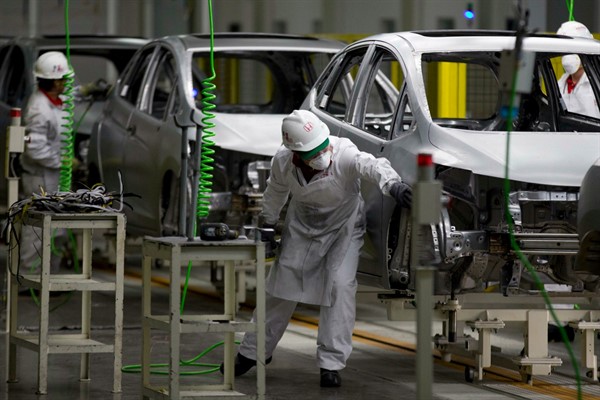 Employees at work in the Honda car plant in Celaya, Mexico, Feb. 21, 2014 (AP photo by Eduardo Verdugo).