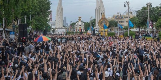 Pro-democracy protesters raise three fingers, a symbol of resistance, during a rally in Bangkok, Thailand, Aug, 16, 2020 (AP photo by Sakchai Lalit).