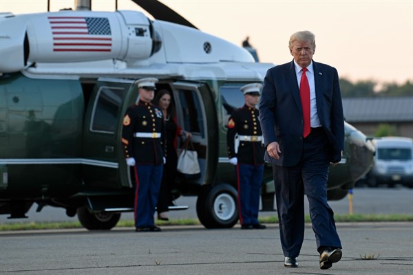 President Donald Trump walks from Marine One at Morristown Municipal Airport in Morristown, N.J., Aug. 9, 2020 (AP photo by Susan Walsh).