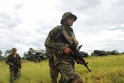 Paraguayan army soldiers patrol an area where two German citizens were killed by the Paraguayan People’s Army after they were kidnapped, in Yby Yau, Paraguay, Jan. 29, 2015 (AP photo by Enrique Zarza).