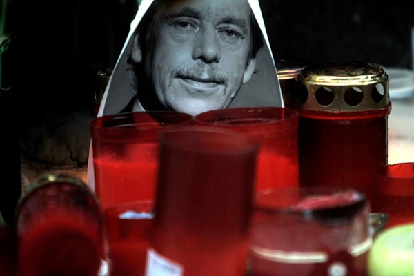 A portrait of Vaclav Havel next to candles at Wenceslas square in Prague, Czech Republic, Dec. 21, 2011 (AP photo by Marko Drobnjakovic).