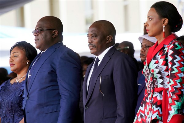 Congolese President Felix Tshisekedi, second left, his wife Denise Nyekeru, and outgoing President Joseph Kabila and his wife, Olive Lembe di Sita, during the inauguration ceremony in Kinshasa, Jan. 24, 2019 (AP photo by Jerome Delay).