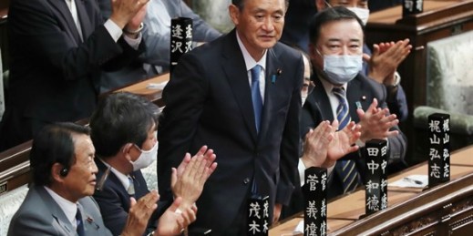 Suga Yoshihide stands after being elected as Japan’s new prime minister, in the lower house of parliament, Tokyo, Sept. 16, 2020 (AP photo by Koji Sasahara).