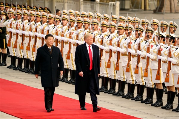 President Donald Trump and Chinese leader Xi Jinping attend a welcome ceremony at the Great Hall of the People, in Beijing, China, Nov. 9, 2017 (AP photo by Andrew Harnik).