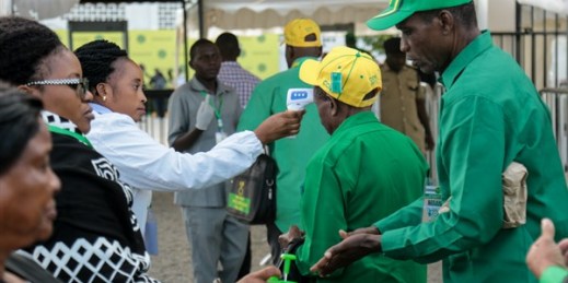 Party members have their temperature checked and sanitize their hands as a precaution against the coronavirus at the national congress of the ruling Chama Cha Mapinduzi party in Dodoma, Tanzania, July 11, 2020 (AP Photo).