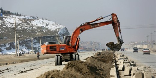 An excavator works on a road construction project in Kabul, Afghanistan, Feb. 10, 2020 (AP photo by Rahmat Gul).