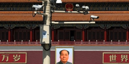 Surveillance cameras near the portrait of former Chinese leader Mao Zedong at the Tiananmen Gate in Beijing, March 15, 2019 (AP photo by Andy Wong).
