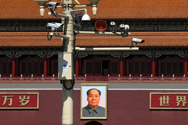 Surveillance cameras near the portrait of former Chinese leader Mao Zedong at the Tiananmen Gate in Beijing, March 15, 2019 (AP photo by Andy Wong).