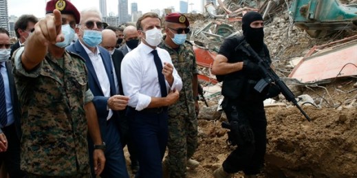 French President Emmanuel Macron, center, visits the devastated site of the explosion at Beirut’s port, Lebanon, Aug. 6, 2020 (AP photo by Thibault Camus).