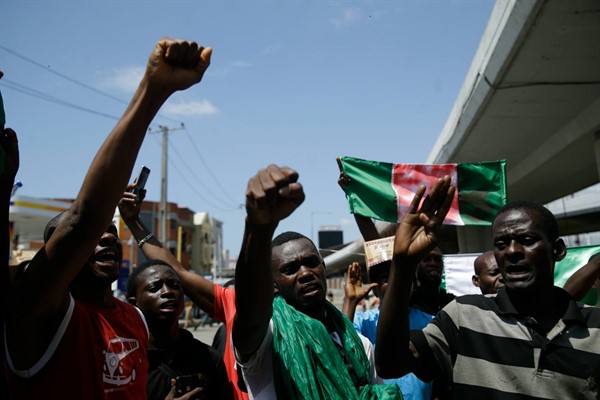 People protest against police brutality in Lagos, Nigeria, Oct. 20, 2020 (AP photo by Sunday Alamba).