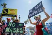 Anti-lockdown demonstrators in Huntington Beach, California, June 27, 2020 (AP photo by Marcio Jose Sanchez).