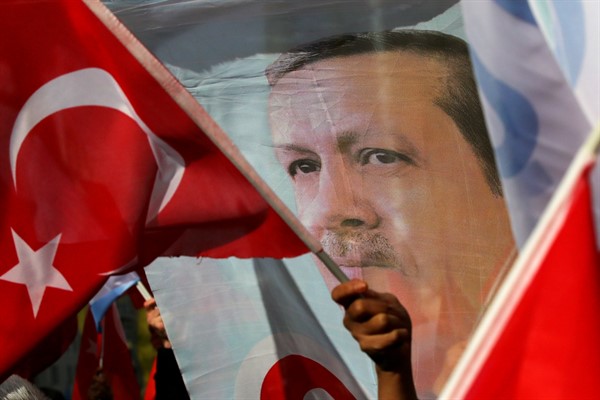 Pro-Erdogan supporters wave flags and banners in Brussels, Belgium, March 9, 2020 (AP photo by Olivier Matthys).