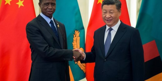 Zambian President Edgar Lungu shakes hands with Chinese leader Xi Jinping at the Great Hall of the People, in Beijing, Sept. 1, 2018 (pool photo by Nicolas Asfouri via AP).
