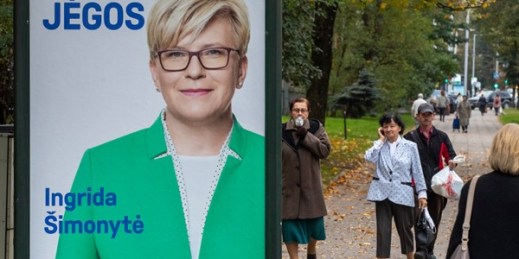 An election poster showing Lithuania’s incoming prime minister, Ingrida Simonyte, in Vilnius, Lithuania, Oct. 9, 2020 (AP photo by Mindaugas Kulbis).
