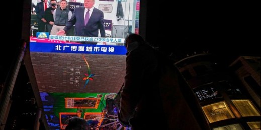 A giant TV screen shows an image of President Donald Trump during a newscast about the U.S. presidential election, at a shopping mall in Beijing, Nov. 8, 2020 (AP photo by Andy Wong).