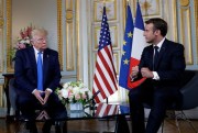 U.S. President Donald Trump and French President Emmanuel Macron meet in Caen, France, June 6, 2019 (AP photo by Alex Brandon).