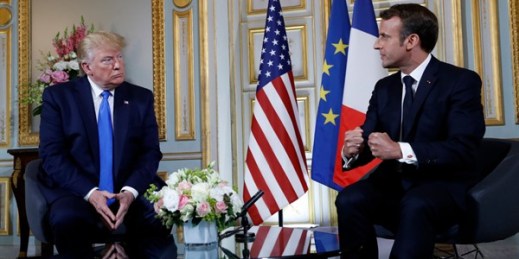U.S. President Donald Trump and French President Emmanuel Macron meet in Caen, France, June 6, 2019 (AP photo by Alex Brandon).