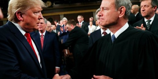 President Donald Trump greets Supreme Court Chief Justice John Roberts before delivering his State of the Union address, in Washington, Feb. 4, 2020 (Pool photo by Leah Millis via AP Images).