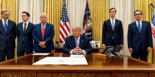 President Donald Trump, center, with various Middle East advisers and U.S. officials in the Oval Office at the White House, Washington, Aug. 12, 2020 (AP photo by Andrew Harnik).