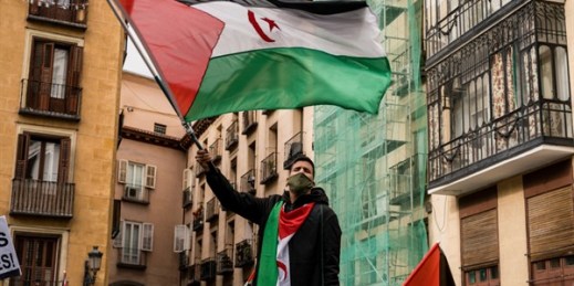 A protester waves the Sahrawi flag during a demonstration in front of the Spanish Ministry of Foreign Affairs, Madrid, Dec. 10, 2020 (Photo by Diego Radames for Sipa via AP Images).