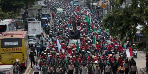 Indonesian workers protest against the controversial omnibus bill, in Tangerang, Indonesia, Oct. 7, 2020 (AP photo by Dita Alangkara).