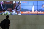 A man watches TV screens showing North Korean weapons systems, top right, in Seoul, South Korea, May 10, 2019 (AP photo by Ahn Young-joon).