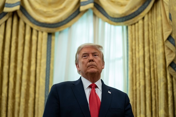 President Donald Trump listens during a ceremony in the Oval Office of the White House, in Washington, Dec. 3, 2020 (AP photo by Evan Vucci).