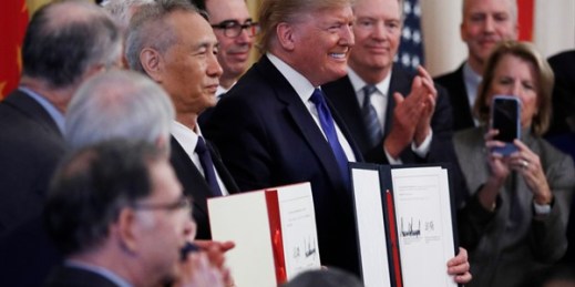 President Donald Trump and Chinese Vice Premier Liu He sign “phase one” of a U.S.-China trade agreement, in the White House, Washington, Jan. 15, 2020 (AP photo by Steve Helber).