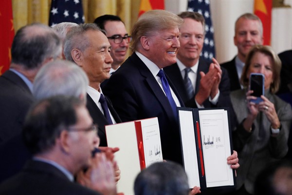 President Donald Trump and Chinese Vice Premier Liu He sign “phase one” of a U.S.-China trade agreement, in the White House, Washington, Jan. 15, 2020 (AP photo by Steve Helber).