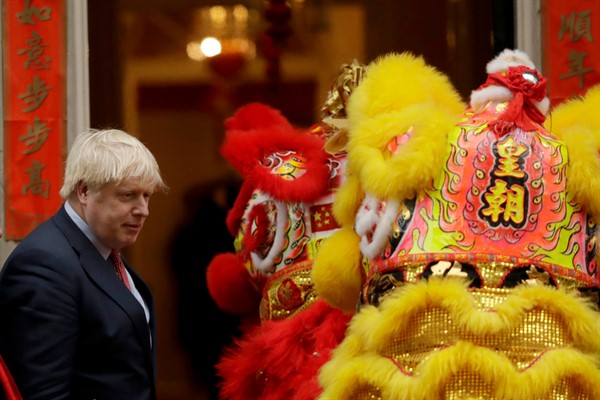 British Prime Minister Boris Johnson with performers dressed as lions as he welcomes members of the British Chinese community for Lunar New Year celebrations in London, Jan. 24, 2020 (AP Photo by Matt Dunham).