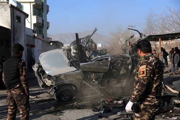 Afghan security personnel inspect the site of a bombing attack in Kabul, Afghanistan, Dec. 16, 2020 (AP photo by Rahmat Gul).