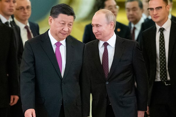 Russian President Vladimir Putin, center right, and Chinese leader Xi Jinping, center left, enter a hall for talks, in the Kremlin, Moscow, Russia, June 5, 2019 (AP photo by Alexander Zemlianichenko).