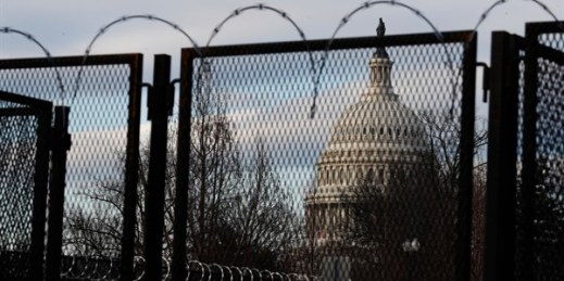 Steel fencing and barbed wire surround the Capitol building ahead of President-elect Joe Biden’s inauguration ceremony, Washington, Jan. 19, 2021 (AP photo by Rebecca Blackwell).